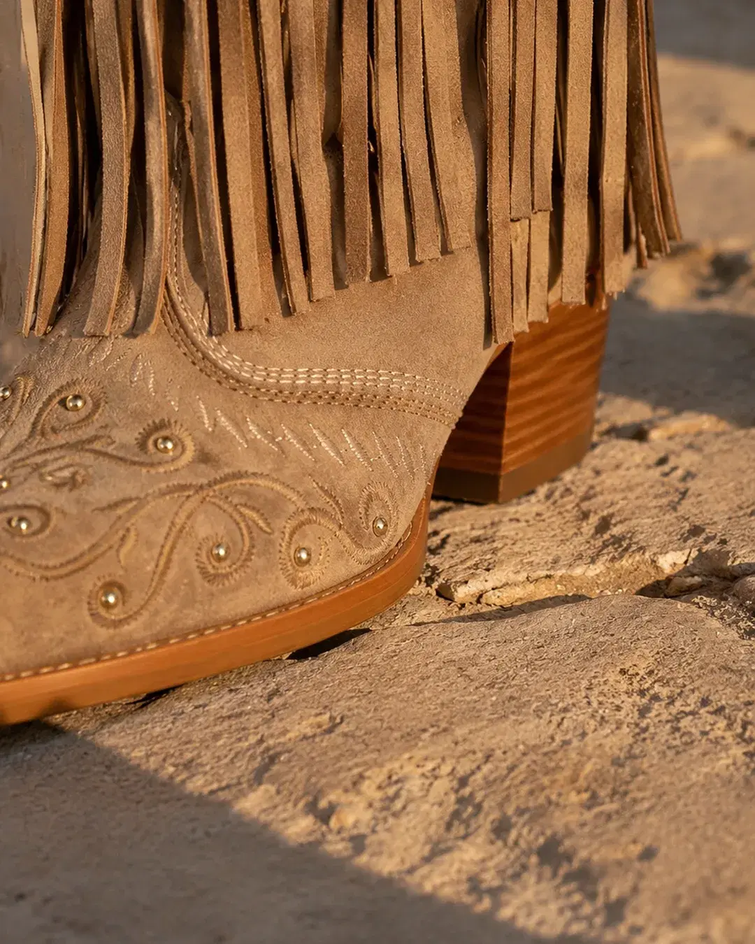 The snip toe and stacked wood Cuban heel at ground level