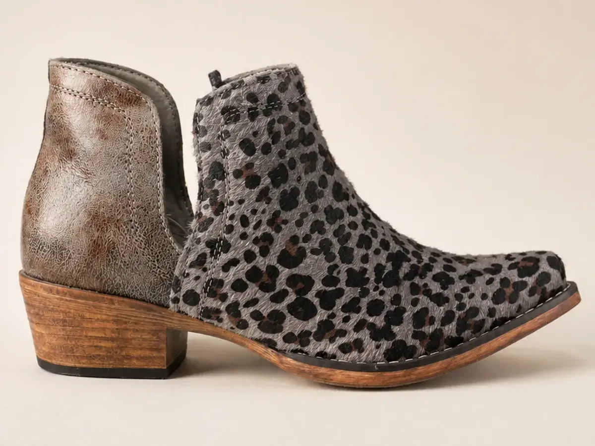 Studio side profile showing the full silhouette, snip toe and stacked heel